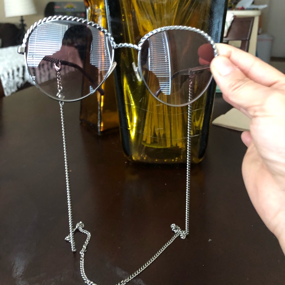 Chanel sunglasses with chain.